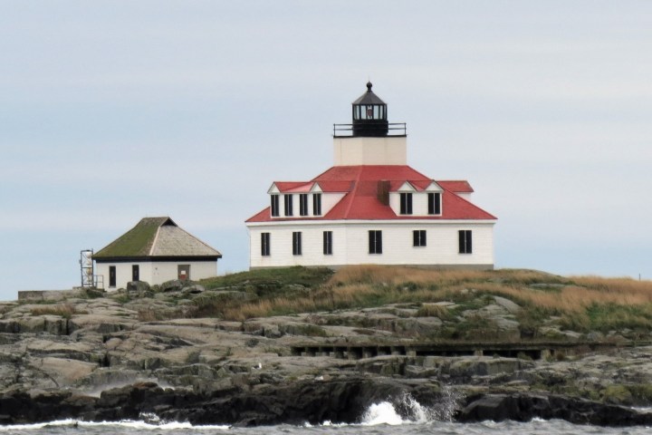 a house next to a body of water